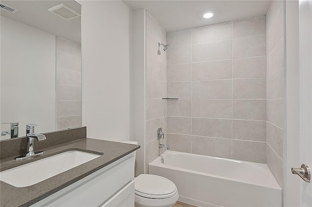 full bath featuring toilet, vanity, bathtub / shower combination, and visible vents