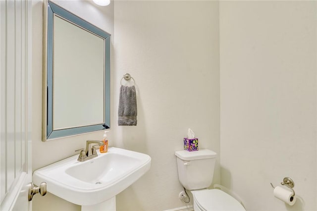 bathroom with toilet and sink