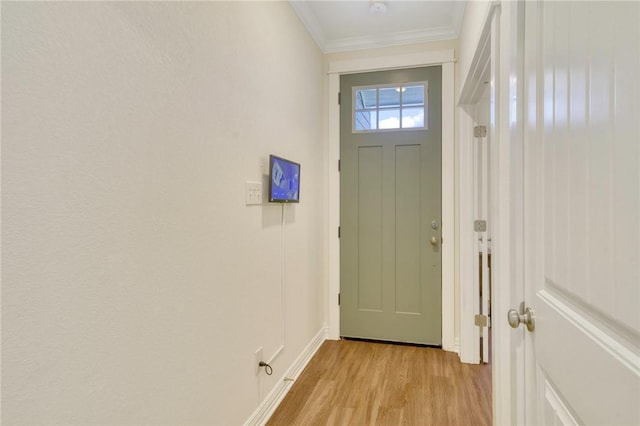 doorway to outside featuring light hardwood / wood-style flooring and ornamental molding