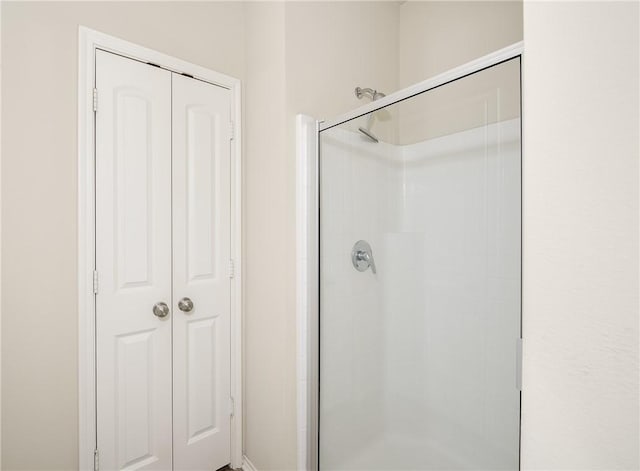 full bath featuring a shower stall