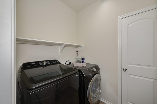 washroom with laundry area and independent washer and dryer