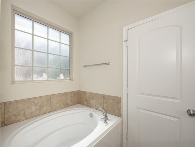 bathroom with a garden tub