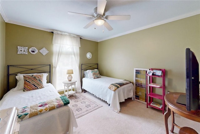 bedroom with ornamental molding, carpet, and a ceiling fan