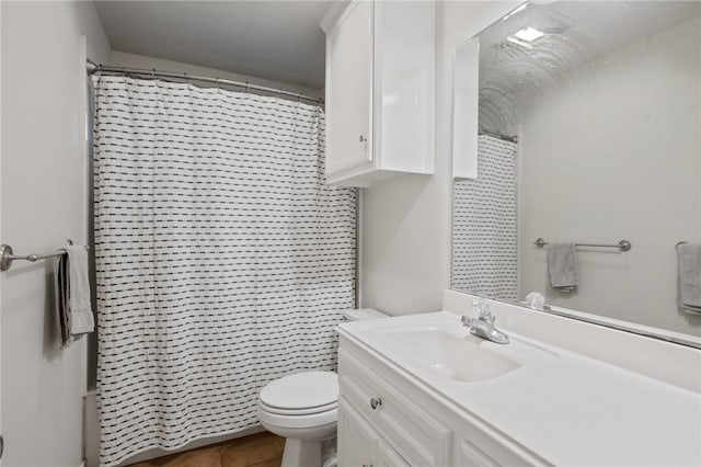 full bath featuring toilet, vanity, tile patterned floors, and curtained shower