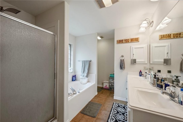 bathroom featuring tile patterned flooring, a stall shower, a garden tub, and double vanity