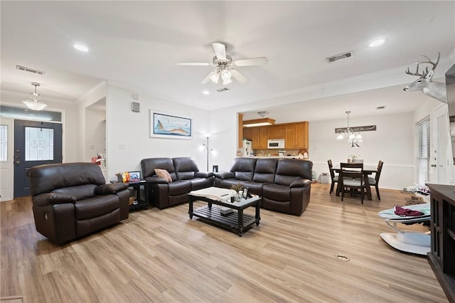 living area featuring crown molding, light wood finished floors, a ceiling fan, and recessed lighting