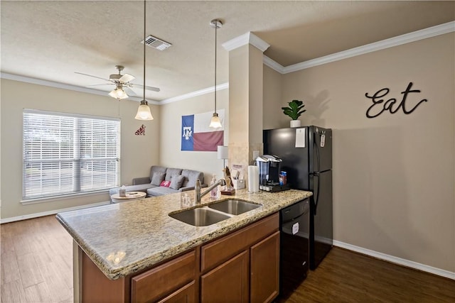 kitchen with dark wood-type flooring, black appliances, crown molding, sink, and ceiling fan