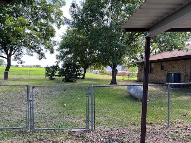 view of yard featuring a rural view and cooling unit