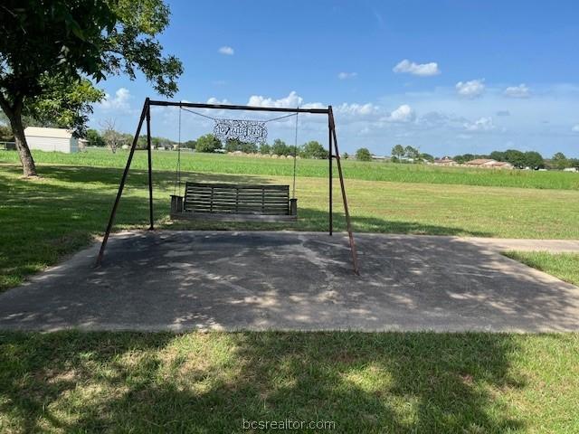 view of community with a playground and a lawn