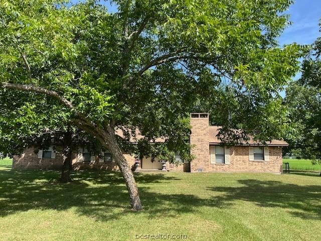 489 County Road 265, Snook, TX 77878 - view of green lawn