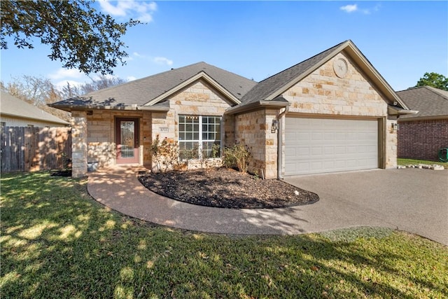 view of front of property featuring a front lawn and a garage