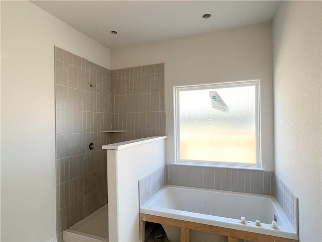 bathroom featuring plus walk in shower