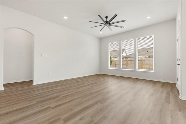 unfurnished room featuring ceiling fan and light hardwood / wood-style flooring