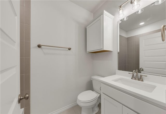 bathroom with vanity, toilet, and tile patterned flooring