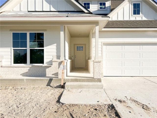 doorway to property featuring a garage