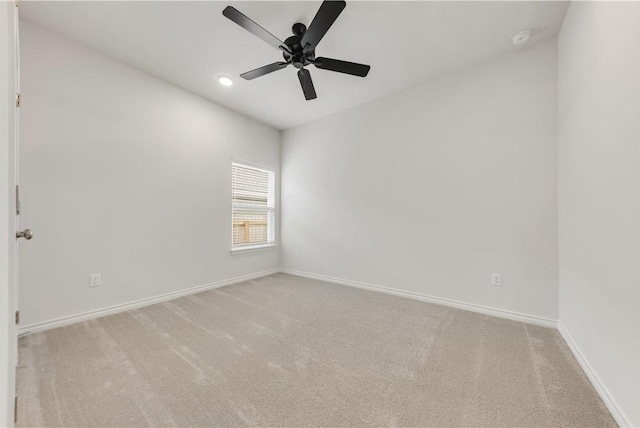 carpeted empty room with ceiling fan