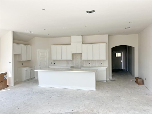 kitchen featuring white cabinets and a spacious island