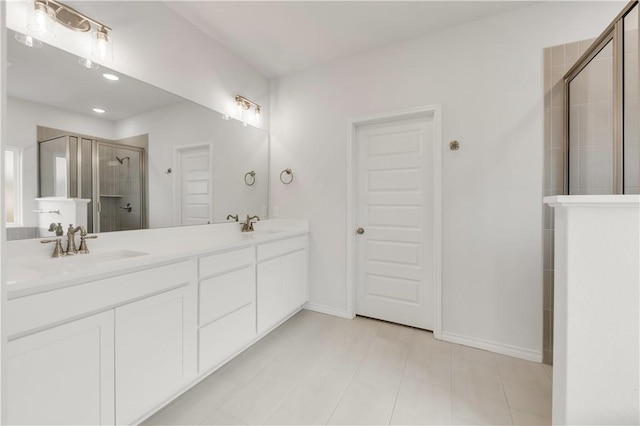 bathroom featuring vanity and an enclosed shower