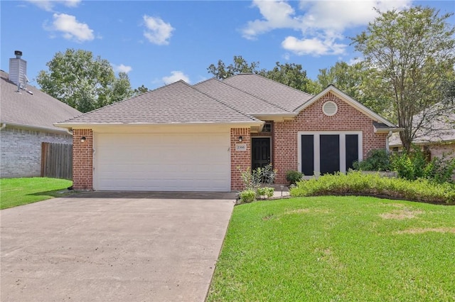 ranch-style home featuring a garage and a front yard