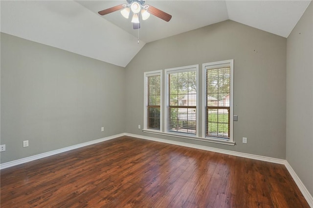 empty room with ceiling fan, lofted ceiling, and dark hardwood / wood-style flooring