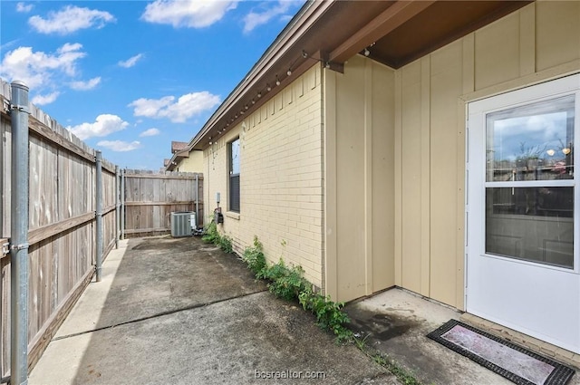 view of side of home with a patio