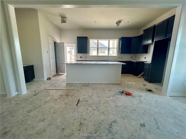 kitchen featuring a center island and tasteful backsplash