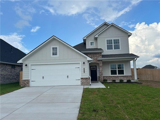 craftsman house with a garage and a front lawn