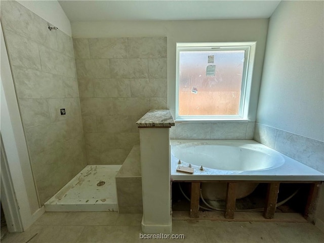 bathroom featuring tile patterned flooring, lofted ceiling, and shower with separate bathtub