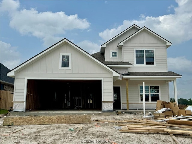 view of front of home with covered porch and a garage