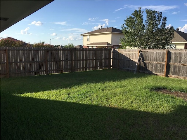 view of yard featuring a fenced backyard