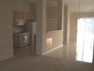 unfurnished room with baseboards