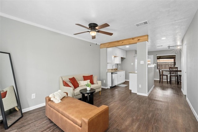 living room with dark hardwood / wood-style flooring, ceiling fan, ornamental molding, and sink