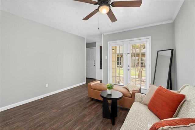 sitting room with french doors, dark hardwood / wood-style floors, ceiling fan, and crown molding