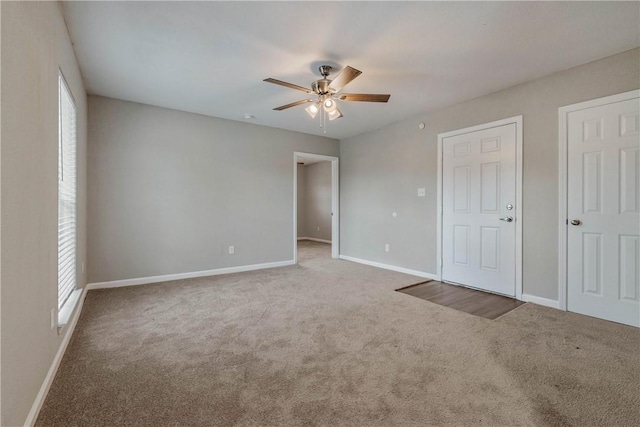 615 San Jacinto Ln, Bryan, TX 77803 - unfurnished bedroom with carpet floors and a ceiling fan