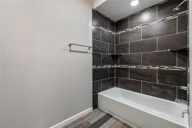 615 San Jacinto Ln, Bryan, TX 77803 - full bathroom featuring wood finished floors, washtub / shower combination, and recessed lighting