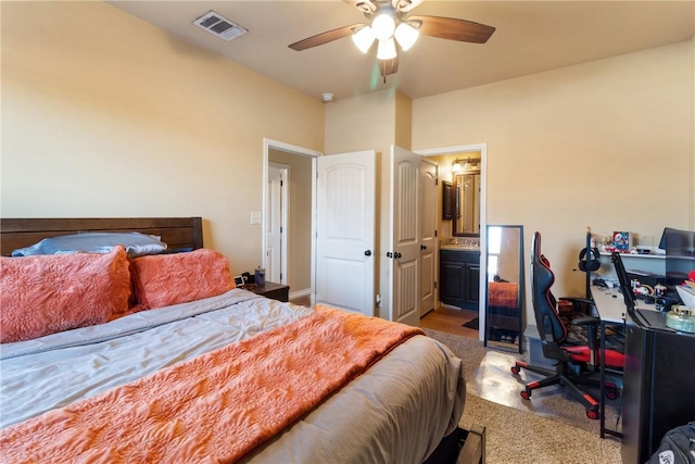 bedroom with connected bathroom, carpet floors, and ceiling fan