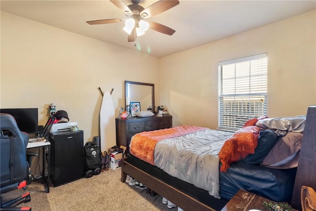 bedroom featuring light carpet and ceiling fan