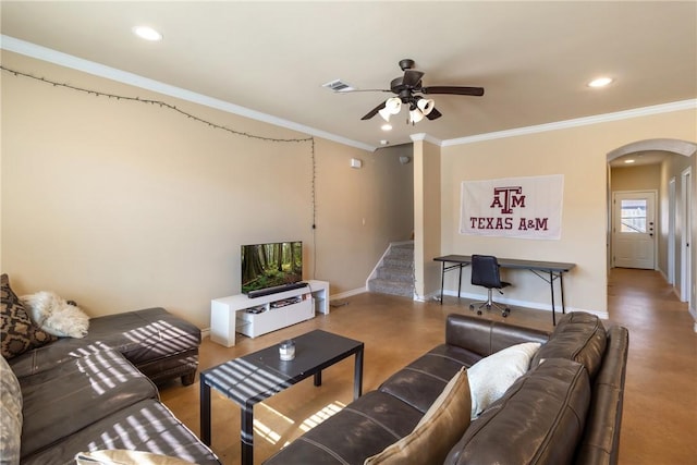 living room featuring ceiling fan, ornamental molding, and concrete flooring