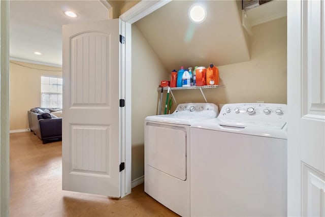 clothes washing area featuring separate washer and dryer