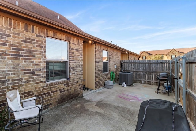 view of patio / terrace featuring central AC unit and grilling area