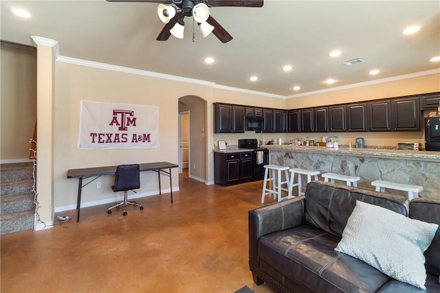 living room with ornamental molding and ceiling fan