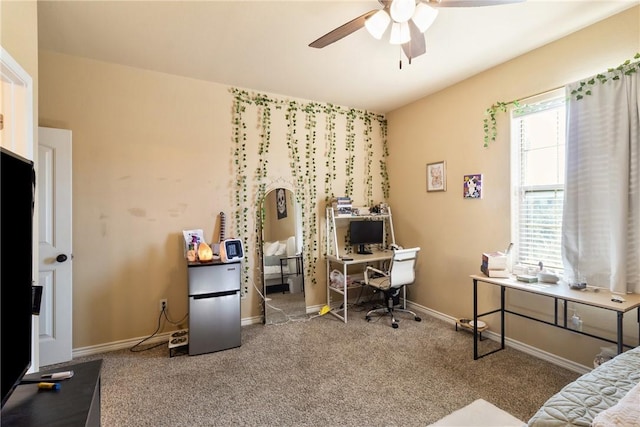 bedroom with ceiling fan, stainless steel fridge, and carpet floors