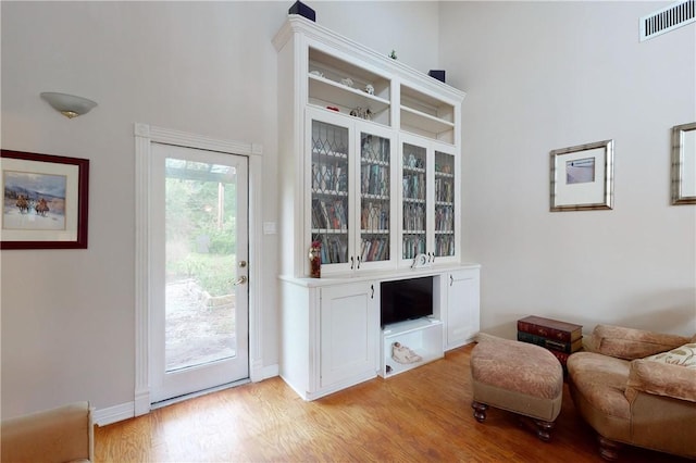 sitting room featuring light hardwood / wood-style floors