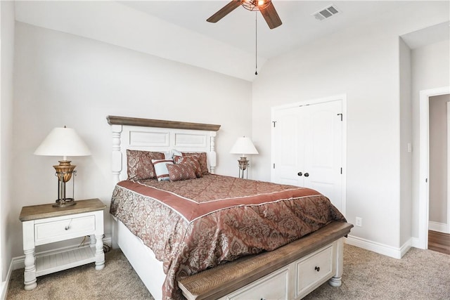 carpeted bedroom with a closet and ceiling fan