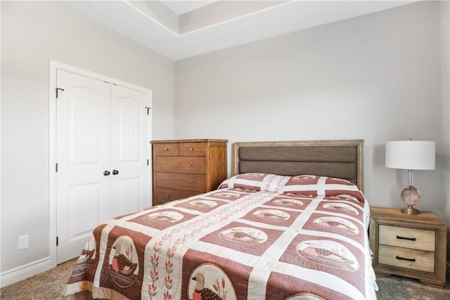 bedroom featuring a closet and carpet