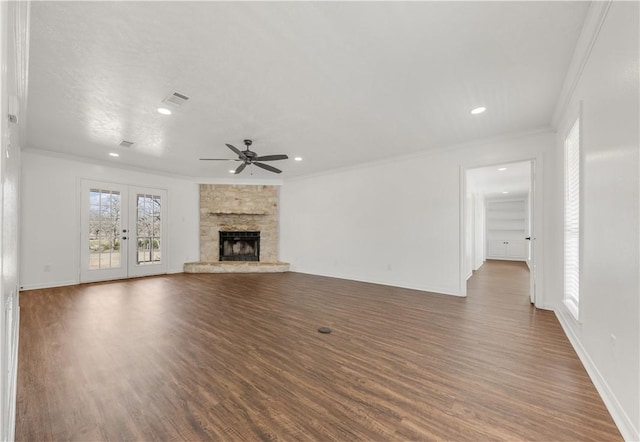 unfurnished living room with crown molding, dark hardwood / wood-style floors, and a fireplace