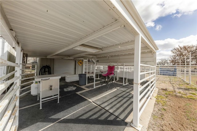 view of patio with an outbuilding