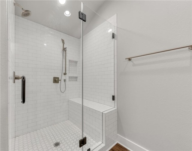 bathroom with a shower with shower door