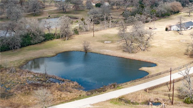 view of swimming pool featuring a water view