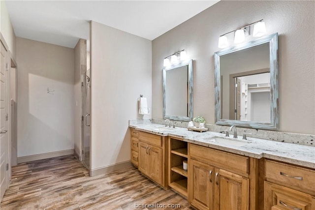 bathroom featuring hardwood / wood-style flooring and vanity